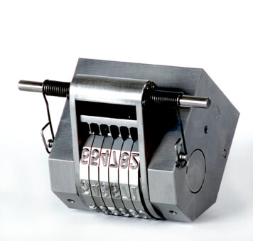 The Model 50P Automatic Numbering Head represents the finest marking device in the industry for rapid, accurate, and consecutive numbering.